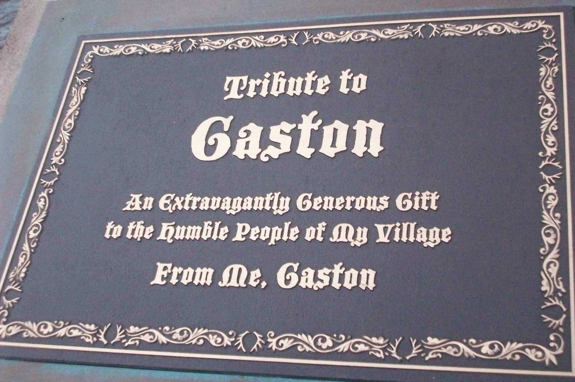 Gastons Statue Plaque outside Gastons Tavern