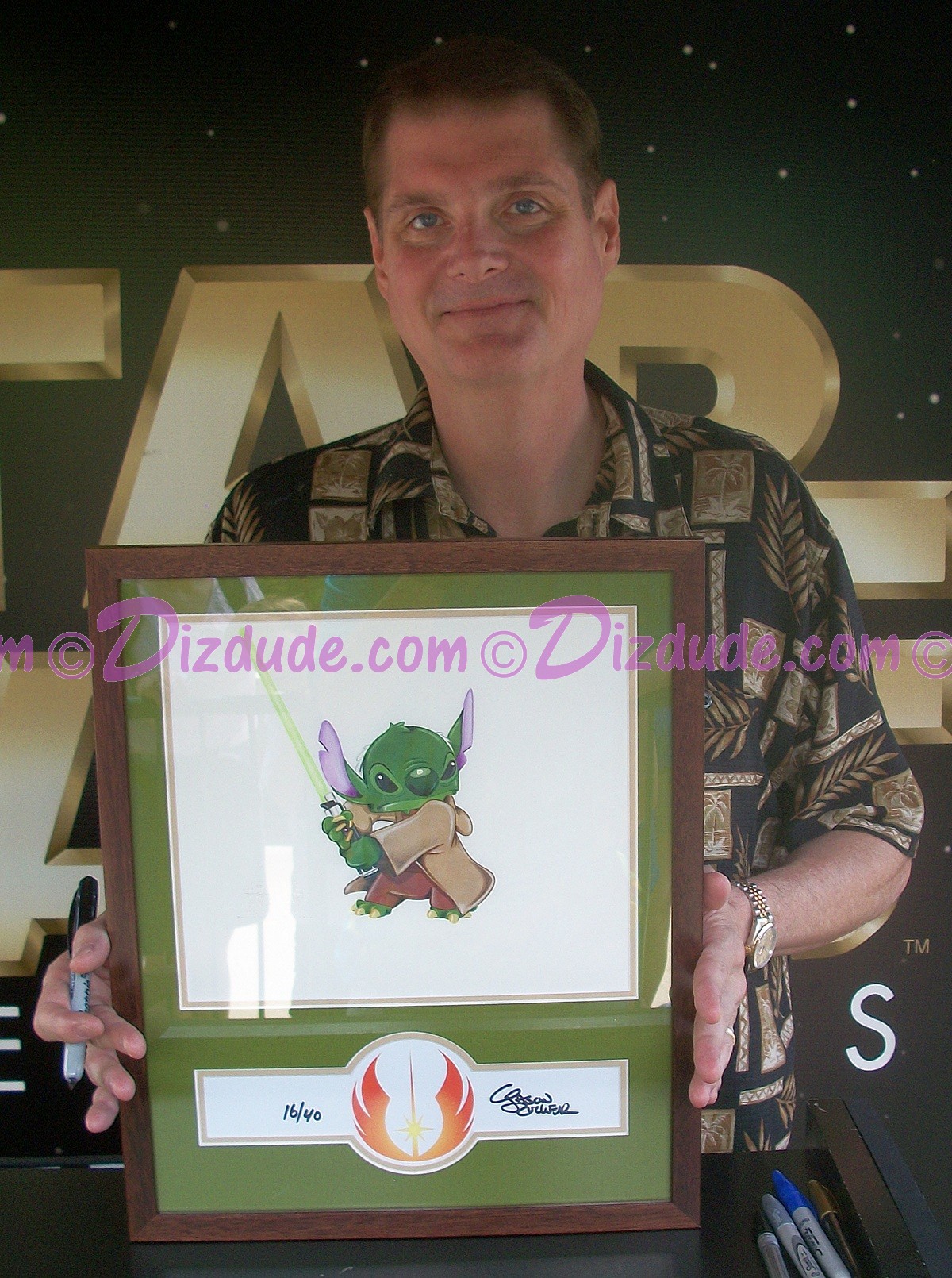 Tom Kane "The Voice of Yoda" Holding this beautiful "Stitch as Yoda" Nr 16 illustration June 10, 2011 at Star Wars Weekends ~ © DIZDUDE.com